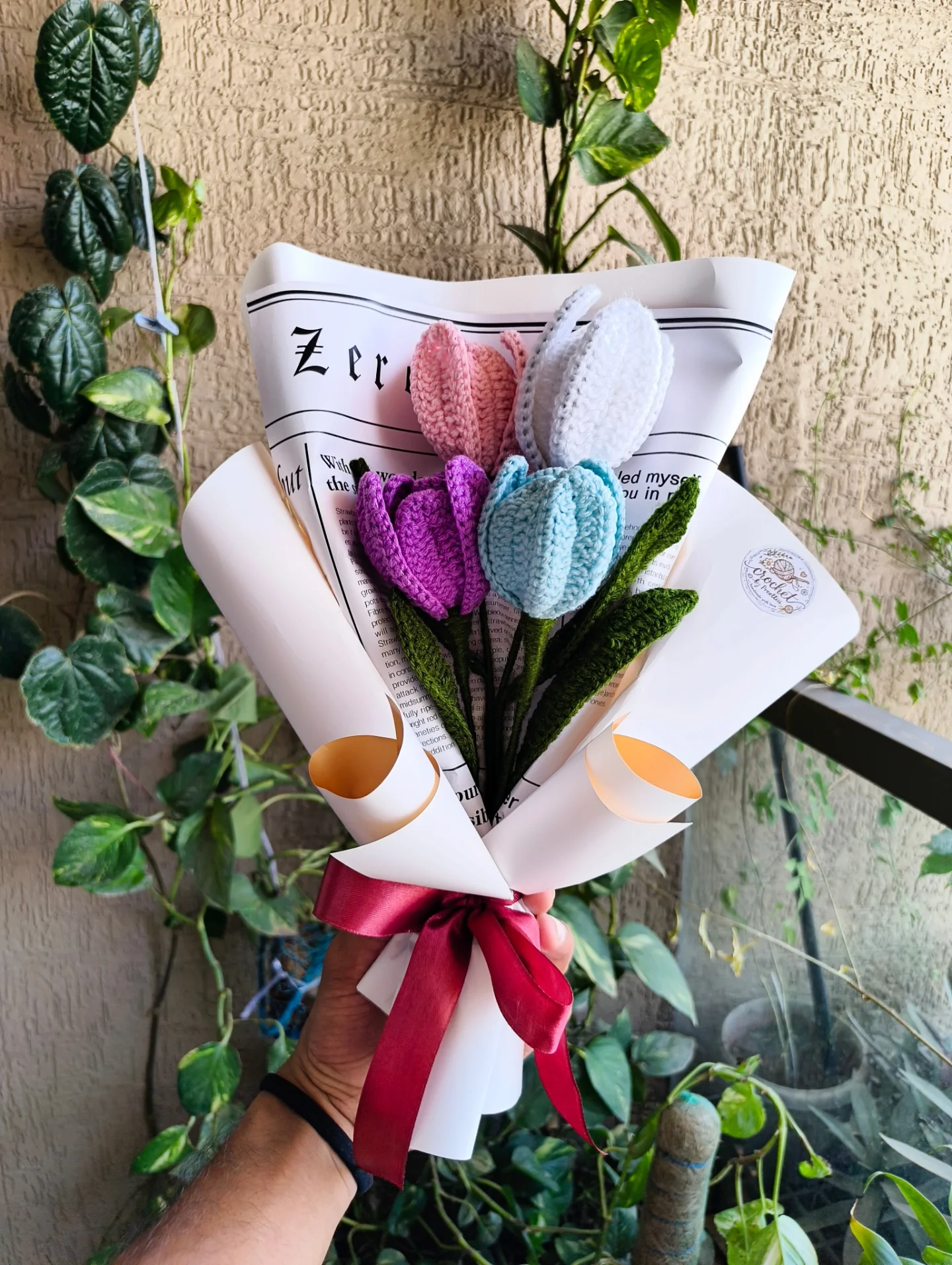 Pastel tulips in vintage newspaper wrap.